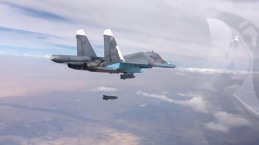A Su-34 drops a KAB-500S satellite guided bomb