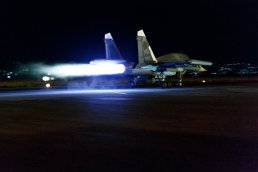 Su-34 taking off at night, loaded with KAB-500S bombs